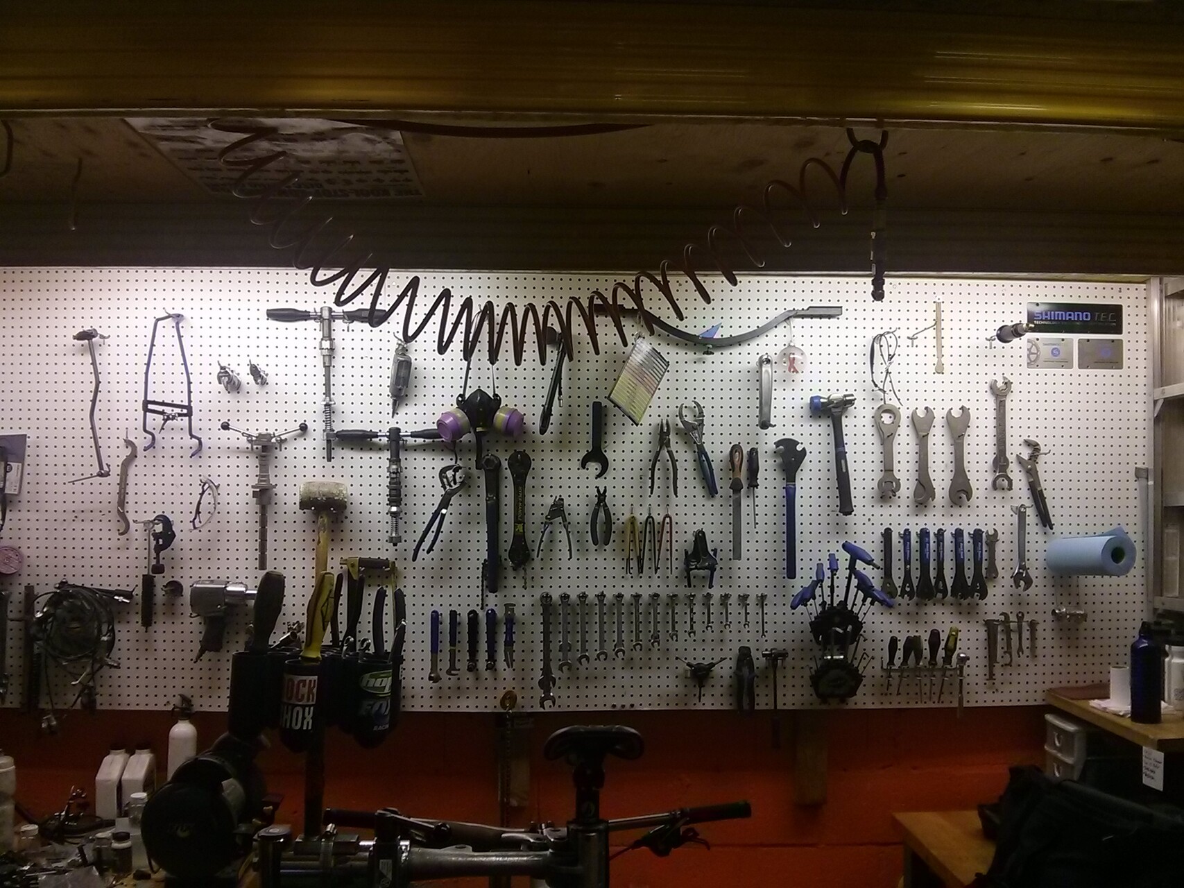 A detailed view of a mechanic's workbench with organized tools