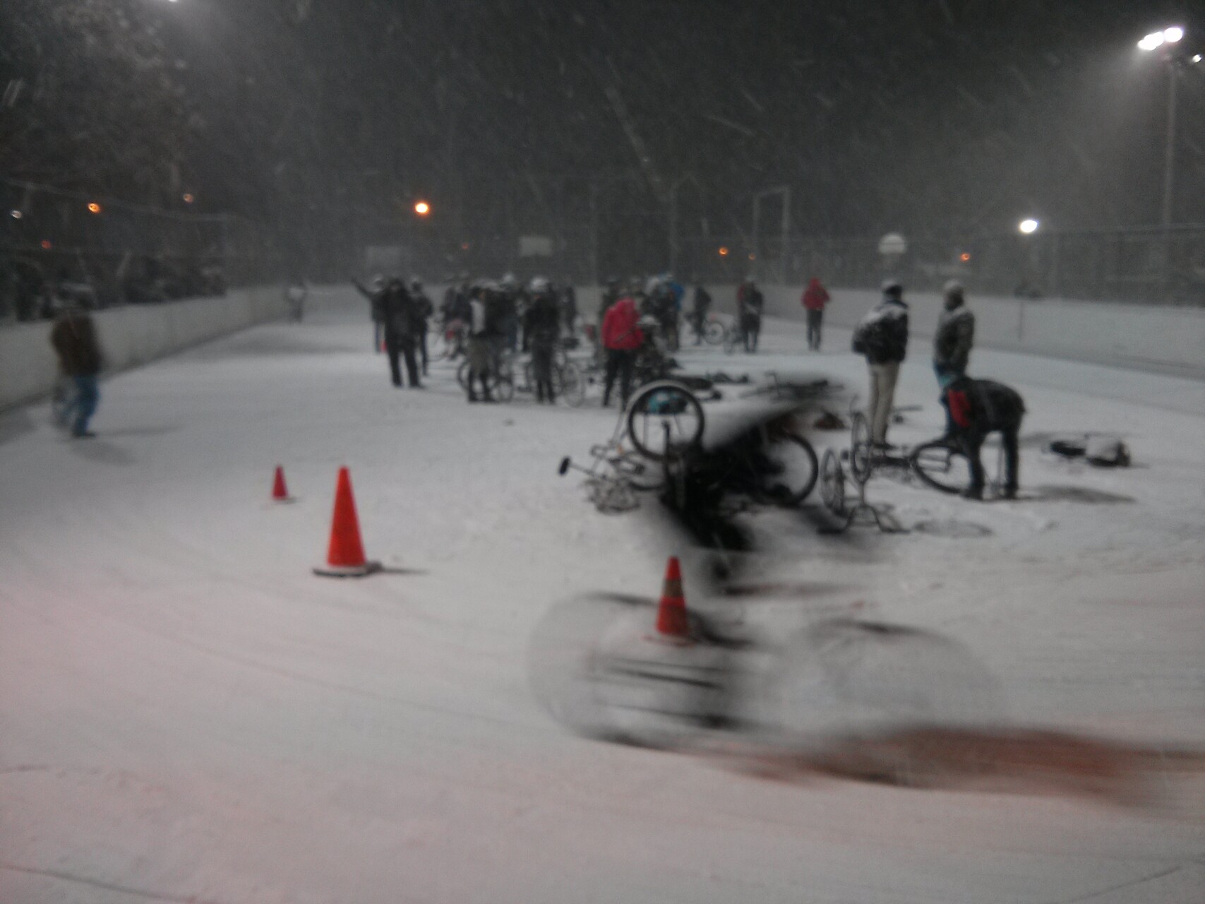 A late night winter bike race on a skating rink