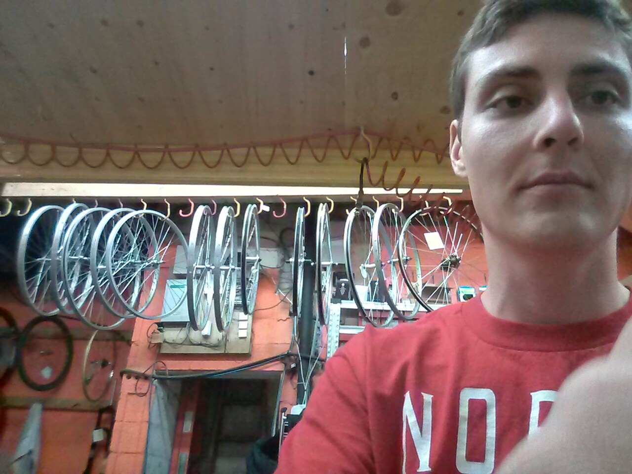 The author focuses intently on truing a bicycle wheel