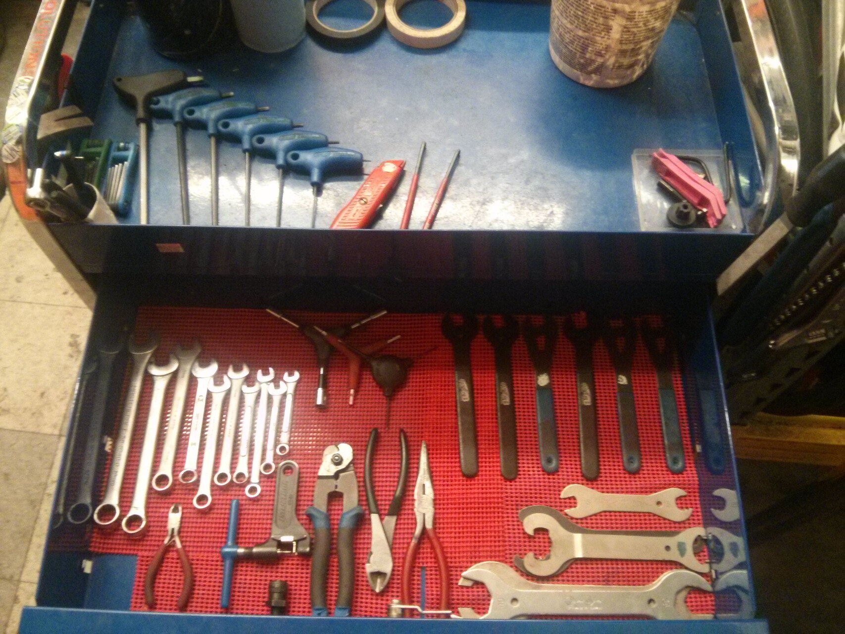 Close-up of a pedal and crank arm on a work stand