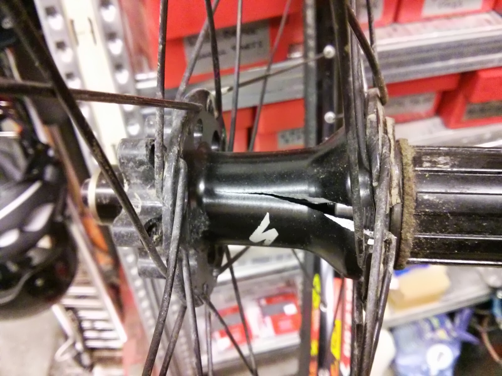A destroyed bicycle rear hub with shattered parts