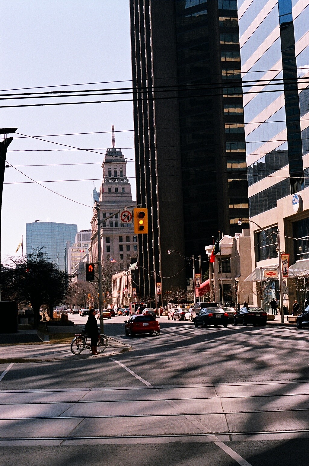 A cyclist waiting for traffic near St. Patrick station