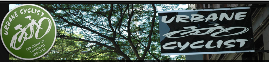 The storefront of Urbane Cyclist on a vibrant Toronto street